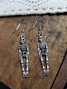 "Give a scare with the spooky detailed silver full body skeleton dangle earrings French hooks are hypoallergenic steel  Mr. Skeleton measures about 1.5\" in from head to toe **all of my charms are nickle and lead free  * your item arrives packaged and ready for gift giving  ** custom orders are always welcome simply message me Find more great Halloween jewelry in my shop !  Luxedesignsbysarah.etsy.com  Tags: Halloween jewelry, Halloween dangle earrings, silver skeleton earrings, silver bone earr Full Body Skeleton, Jewelry Vampire, Body Skeleton, Skeleton Jewelry, Vampire Jewelry, Skeleton Earrings, Jewelry Halloween, Bone Earrings, Dangle Earrings Silver