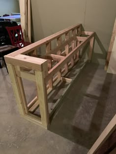 a wooden bench sitting on top of a hard wood floor