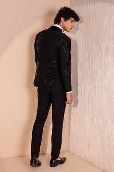 Black full sleeves astron  embroidered tuxedo with tonal sequin embellishments. Paired with a pant. - Aza Fashions Fitted Black Embellished Pants, Fitted Embellished Black Pants, Fitted Black Pants For Wedding, Fitted Sequin Luxury Pants, Embroidered Fitted Bandhgala For Winter, Embroidered Fitted Tuxedo With Long Sleeves, Formal Embellished Black Pants, Black Embellished Formal Pants, Festive Formal Embellished Pants