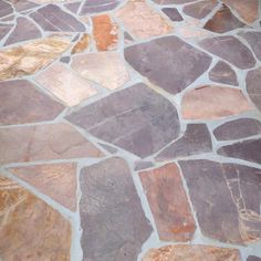 Flagstone pavers are the number 1 choice for landscape professionals due to their low maintenance, easy installation and aesthetic appeal. Typically used for outdoor projects such as patios, pathway stepping stones and more, each piece of flagstone has a unique size, shape and color. Because no 2-pieces are alike, it has become the ideal choice for custom hardscaping projects and garden designs. Flagstone pavers are installed in 1 of 2 ways: The first method is generally used for pathways and st Patio Flagstone, Flagstone Pathway, Rock Pathway, Flagstone Patio, Garden Stepping Stones, Natural Stone Pavers, Garden Steps, Landscaping Supplies