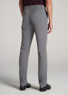 About Our Men's Tall Pants These extra-long chinos strike the perfect balance between classic and comfortable. They're designed to look like a pair of tapered chinos but are made of a lighter stretchy fabric that provides plenty of room for movement so you can tee off on the golf course, take the dog for a walk or grab dinner with friends at that new restaurant in town. We know how hard it is to find men's tall pants, which is why we made sure this pair had an extra-long inseam measured specific Mens Work Outfits, Tapered Chinos, Chino Pants Men, Tall Men, New Restaurant, Tall Pants, Dinner With Friends, Collar Cardigan, Chino Jeans