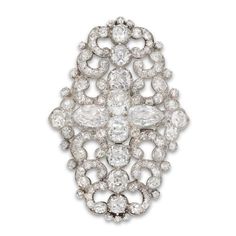 For Sale on 1stDibs - A fine Victorian diamond scroll brooch strung here as a centrepiece on a cultured pearl choker necklace, centrally-set set with a row of graduating old Ornate Diamond Brooch For Formal Occasions, Ornate Diamond Brooch For Formal Wear, Ornate Diamond Brooches For Formal Occasions, Classic Wedding Brooch With Brilliant Cut, Elegant Oval Wedding Brooches, Oval Diamond Wedding Brooch, Oval Diamond Wedding Brooches, Luxury Oval Wedding Brooches, Classic Diamond White Brooch Jewelry