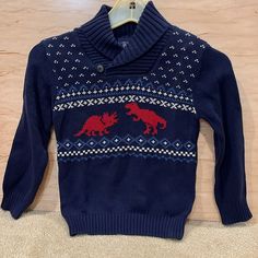 Dark Blue Sweater. Two Red Dinosaurs On The Front. Nwt. Blue Dinosaur Print Long Sleeve Top, Blue Long Sleeve Dinosaur Print Top, Long Sleeve Blue Top With Dinosaur Print, Blue Long Sleeve Top With Dinosaur Print, Dark Blue Sweater, Dinosaur Sweater, Childrens Place, Boys Top, Blue Sweaters