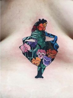 a woman's chest with flowers on it