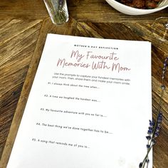 a menu for a mother's day celebration on a table next to a bowl of food