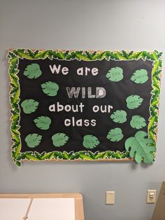 a sign that says we are wild about our class on the side of a wall