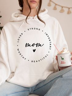 "Strong Important Beautiful Worthy Loved Mom Hoodie, Mom life Hoodie, Mothers Day Hoodie, Mothers Day Gift, Motivational Shirt, Mother Day    Hi! Welcome to✨Northstar Sweatshirt &Hoodies✨ ✨As the weather gets colder, you want clothes that keep you and your body warm. Here, Northstar Sweatshirt &Hoodies is ready to keep you warm with its unique designs. These soft and cotton sweatshirts and hoodies can be combined with anything.✨ ✨Product Features✨ 👉Medium-heavy fabric (8.0 oz/yd² (271.25 g/m 👉Loose fit 👉Runs true to size 👉50% cotton, 50% polyester 👉Tear-away label 👉Youth Hoodies do not have drawcord for added safety ✨Care Instructions✨ 👉Wash item inside out in cold water, do not bleach, do not dry clean, do not iron directly on the design. ✨How To Order✨ 👉 First, please review all White Cotton Hoodie For Mother's Day, Cotton Hooded Sweatshirt For Mother's Day, Cotton Hooded Hoodie For Mother's Day, Mother's Day Hooded Hoodie With Letter Print, Long Sleeve Hoodie With Letter Print For Mother's Day, Motivational Hoodies, Strong Mom, Mom Hoodies, Youth Hoodies