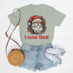 Spread holiday cheer with a humorous touch wearing our Santa 'I Saw That' T-shirt! Embrace the joy of the season with this whimsical tee featuring Santa's knowing gaze and the playful phrase 'I Saw That.' Crafted for comfort and a dash of festive humor, this tee is perfect for adding a light-hearted touch to your holiday wardrobe.Want to spend every day in the comfort of Saturday morning? Slip on a Comfort Colors 1717 Adult Tee and enjoy the softness of 100% USA grown ring-spun cotton. The fabri Fun Christmas Crew Neck T-shirt, Fun Christmas T-shirt With Graphic Print, Funny Holiday T-shirt With Graphic Print, Funny Graphic Print T-shirt For Holidays, Holiday Graphic Tee With Funny Print, Holiday Cotton T-shirt Pre-shrunk, Casual Pre-shrunk Holiday T-shirt, Casual Pre-shrunk T-shirt For Holiday, Christmas T-shirt With Funny Print