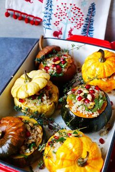 several stuffed pumpkins are in a red box