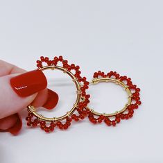 Beautiful Red Seed Beads were carefully wrapped around gold hoops with gold wire.  These, beautiful, hoop earrings are in 30mm (1 inch) diameter. (Please see the pictures that include a tape measure and a quarter for size reference.)  These earrings will quickly elevate any outfit! Cotton Filled Box Included. Handmade in the USA. --------  Find more Beautiful Pieces at AshbeesAccessories 🛍 Gemstone Necklaces: https://www.etsy.com/shop/AshbeesAccessories?section_id=24082817 Necklaces: https://www.etsy.com/shop/AshbeesAccessories?section_id=23201100 Gemstone Bracelets: https://www.etsy.com/shop/AshbeesAccessories?section_id=24071970 Bracelets: https://www.etsy.com/shop/AshbeesAccessories?section_id=23355728 Gemstone Earrings: https://www.etsy.com/shop/AshbeesAccessories?section_id=24071982 Adjustable Hoop Earrings With Gold Beads As Gift, Adjustable Gold Beads Hoop Earrings As Gift, Adjustable Gold Beaded Hoop Earrings As Gift, Gold Beaded Hoop Earrings Gift, Small Hoop Earrings With Gold Beads As A Gift, Gold Beaded Metal Hoop Earrings As Gift, Festive Red Hoop Earrings, Red Wire Wrapped Hoop Earrings, Teal Bracelet