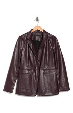 Throw on this faux leather blazer that elevates any outfit with trendy style. 27.5" length (size XS) Peak lapel Long sleeves One-button front closure Front flap pockets Faux leather construction Lined Faux leather face: 100% polyurethane/back: 100% polyester/lining: 100% polyester Hand wash cold, line dry Imported Model’s stats for sizing: 5’11” height, 32” bust, 24” waist, 34” hips. Model is wearing size M. Fitted Faux Leather Blazer For Formal Occasions, Trendy Fall Blazer For Business Casual, Trendy Fall Business Casual Blazer, Trendy Business Casual Blazer For Fall, Trendy Faux Leather Jacket For Business, Faux Leather Single Breasted Blazer For Office, Trendy Fitted Leather Jacket With Lapel Collar, Sleek Fall Blazer For Night Out, Winter Business Faux Leather Blazer