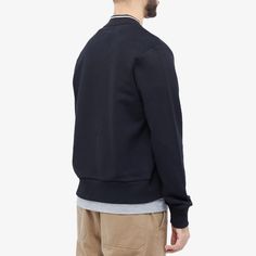 This season sees Fred Perry lend its iconic twin tipping to the collar of this tennis bomber. In slick black, it’s crafted from a soft cotton-poly blend and retains all of the style’s trademarks, including: a zip closure and chunky ribbing. Infused with sporting influence, it’s completed at the chest with the brand’s signature laurel wreath..79% Cotton, 21% Polyester.Zip Closure.2 Side Pockets.Embroidered Branding.Ribbed Trims.Model is 6ft 1in/1.86m with a 35”/89cm chest and is wearing a size Me Cotton Track Jacket With Baseball Collar And Ribbed Cuffs, Cotton Track Jacket With Ribbed Cuffs For Work, Cotton Track Jacket For Workwear, Classic Cotton Varsity Jacket With Ribbed Cuffs, Urban Cotton Varsity Jacket With Ribbed Cuffs, Black Cotton Varsity Jacket With Ribbed Cuffs, Cotton Sweatshirt With Ribbed Cuffs And Baseball Collar, Classic Black Varsity Jacket With Ribbed Collar, Casual Collared Varsity Jacket With Ribbed Cuffs