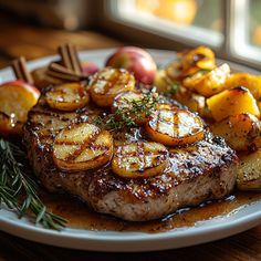 a plate with steak, potatoes and apples on it