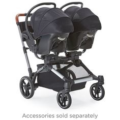 two baby strollers with black seats and wheels on them, both facing each other