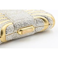 Elegant Judith Leiber minaudière looks like a gift box or pillow with a Swarovski crystal ribbon.  The bag features a press crystal lock closure with  golden hardware, The shoulder strap that can be tucked into the interior of the bag for use as a clutch. The interior is done in metallic leather.  It comes with a Leiber gold comb and mirror as well as a Leiber pouch. Designer Rectangular Evening Bag As Gift, Classic Gold Evening Bag As Gift, Elegant Evening Bag With Rhinestones For Gifts, Classic Gold Evening Bag For Gift, Elegant Rhinestone Evening Bag As Gift, Designer Gold Evening Bag For Formal Occasions, Elegant Rhinestone Evening Bag, Luxury Clutch With Rhinestones For Gift, Luxury Gold Clutch For Formal Occasions