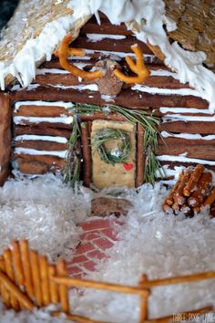 a close up of a gingerbread house with icing