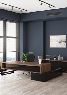 an office with blue walls and wooden floors