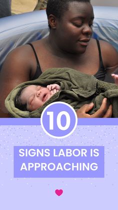 a woman holding a baby in her arms with the words 10 signs labor is approaching