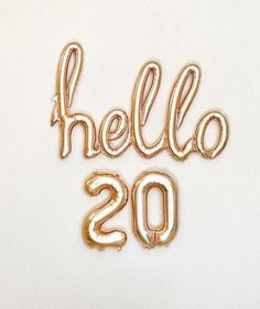 gold foil balloons spelling the word hello 2013