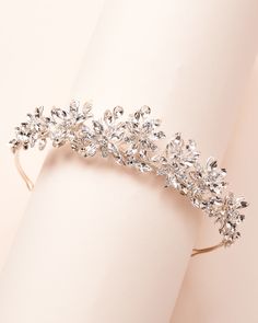 Floral & ethereal, our Natalia Wedding Tiara is fit for royalty. Crafted with crystal flowers & gemstones, this crown will sparkle from all angles on your wedding day. Crystal gemstones & metal flowers; gold version designed with gold crystals Center peak 1.25" Pin loops are located on each end so you can secure in your hair Style #3440 Gold Bridesmaid Jewelry, Crystal Headpiece Wedding, Bride Hair Jewelry, Crystal Bridal Headpiece, Tiara Silver, Crystal Wedding Tiaras, Crystal Crown Wedding, Wedding Tiaras, Crystal Bridal Tiaras