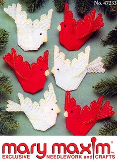 four red and white birds are hanging from a christmas tree with the words mary maxm on it