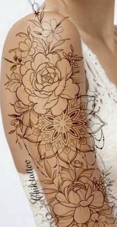 an image of a woman's arm with flowers on it and the words 7 feminine flower shoulder tattoos to make you absolute