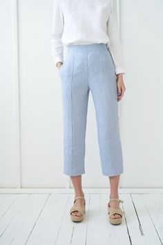 "TORI - finest pair of classic linen pants with a flat front for a polished look. FABRIC: 100% softened Lithuanian linen COLOR: Please choose a color on the side menu. STYLE: Cropped linen flat front pants with rubber at the back and side pockets. SIZE CHART (body measurements) : S Bust 31.5- 35\" (80- 88 cm) Waist 23- 26.5\" (59- 68 cm) Hips 35- 38\" (88- 96 cm) M Bust 35- 38\" (89- 96 cm) Waist 27- 30\" (69- 76 cm) Hips 38- 41\" (97- 104 cm) L Bust 38- 41\" (97- 104 cm) Waist 30.5- 33\" (77- 8 Blue Linen Wide Leg Pants For Workwear, Summer Linen Wide Leg Pants With Straight Hem, Linen Wide Leg Pants For Summer, Linen Cropped Leg Capris For Summer, Summer Linen Cropped Leg Capris, Linen Summer Capris With Cropped Leg, Summer Linen Bottoms With Cropped Leg, Blue Linen Ankle-length Wide Leg Pants, Summer Workwear Pants In Flax Color