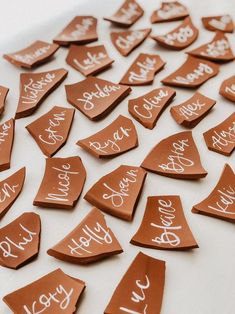 there are many pieces of chocolate that have been cut into the shape of hearts with writing on them