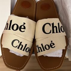 Wore Once For An Event! In Perfect Condition No Signs Of Wear Other Than Bottom (Shown) Chloe Woody Open Square Toe With Criss-Cross Logo Tape Toe Straps Fabric Upper, Fabric Lining, Rubber Sole Comes In Original Box With Dust Bag And Everything Included. Ships Asap They Retail For $475 No Low Balls Will Be Considered Designer Beige Mules For Summer, Designer Round Toe Mules For Beach, Designer Slip-on Mules For Beach, Luxury Beach Mules For Spring, Chic Tan Flat Heel Sandals, Cross Logo, Sandal Slides, Chloe Shoes, Women's Shoes Sandals