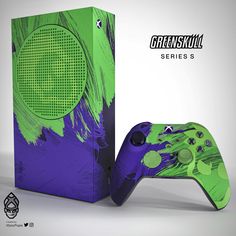 a green and purple xbox controller next to a box