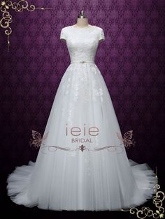 a white wedding dress on display in front of a purple background with the words ieie bridal