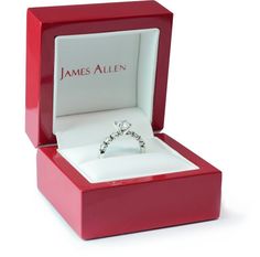 an open red box with a ring inside that says james allen on the front and side