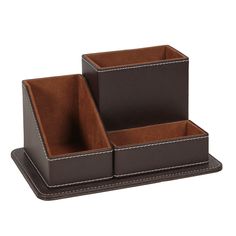 two brown leather containers sitting on top of each other