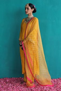 Mango yellow kurta featuring a gathered neckline with sequin and thread embroidery. Paired with a pant and printed sheer dupatta with a cutwork border., Fit: Relaxed Sheer Dupatta, Mango Yellow, Bandhani Print, Yellow Kurta, Gathered Neckline, Embroidered Neckline, Women Kurta, Straight Kurta, Thread Embroidery