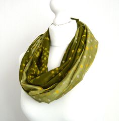 "This stunning recycled silk sari scarf has an all-over tie-dye pattern on an olive green background, it also features the gold metallic border panel running the entire length of the scarf. A stunning design, ideal to wear with so many colours. This scarf is available in three styles; a standard straight rectangular scarf, an infinity or loop scarf where the ends are sewn together to make a loop or a mobius where a twist is added before the ends are sewn to make a mobius loop, just make your sel Green Hand Dyed Bohemian Scarf, Olive Green Tie, Sari Scarf, Boho Scarf, Bohemian Fall, Green Tie Dye, Pure Silk Scarf, Boho Scarfs, Vintage Sari