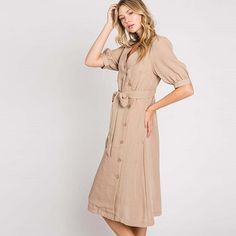 Elevate your wardrobe with our Asymmetrical Button-Down Wrapped Midi Dress, a true embodiment of timeless elegance and style. This dress offers a perfect blend of sophistication and modern flair, ensuring you'll look effortlessly chic and feel confident on any occasion. Key Features: Half-Sleeve Design: The dress features a half-sleeve with button closure, providing a touch of modesty and versatility. You can adjust the sleeves to your preference, making it suitable for various weather condition Fitted V-neck Midi Dress With Button Cuffs, Elegant Dresses With Button Closure, Chic Maxi Dress With Button Closure For Formal Occasions, A-line Midi Dress With Button Closure For Casual Wear, A-line Midi Dress With Covered Buttons, Elegant A-line Shirt Dress With Button Closure, Classic Dresses With Button Closure For Daywear, Feminine Fall Midi Dress With Buttons, Feminine Midi Dress With Button Closure