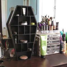 an assortment of cosmetics and beauty products on a desk