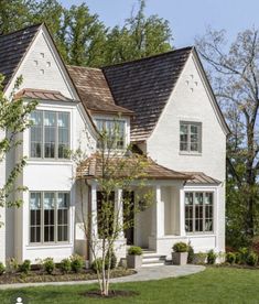 a large white house with two story windows