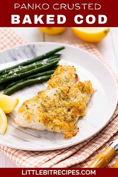 panko crusted baked chicken on a plate with asparagus and lemons