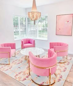 a living room filled with furniture and a chandelier