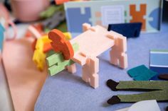 some paper toys are laying on a table