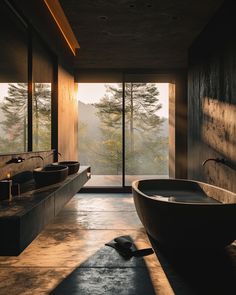 a large bath tub sitting in the middle of a bathroom next to a tall window