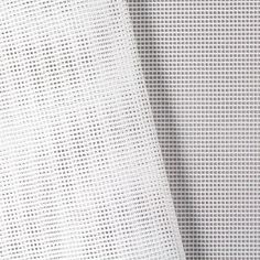 white fabric with small squares on it