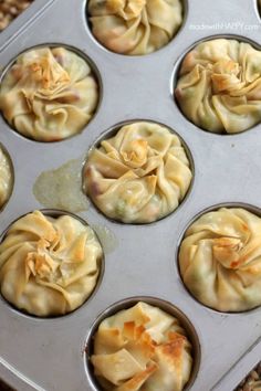 some dumplings are sitting in a muffin tin