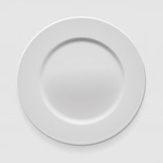 an empty white plate on a white background