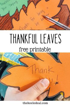 a hand holding a piece of paper that says, thank leaves free printable for thanksgiving