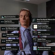 a man wearing a tie and necktie sitting in front of a computer screen with other words on it