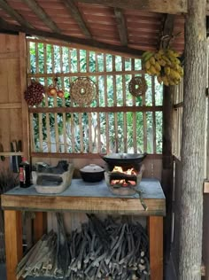 a table with food on top of it in front of a wooden wall and window