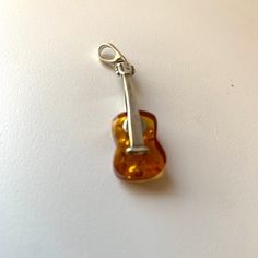 One Of A Kind Guitar Music Instrument Amber Pendant Perfect Gift For Music Lovers Orange Guitar Music Instrument Baltic Amber Pendant Pendant Size 1.5 Inches Long Orange Guitar Baltic Amber Pendant Sterling Silver 925 Perfect Gift For All Ages Nicely Packed, Wrapped In A Gift Pendant Size 1.5 Inches Long Orange Guitar, Long Pendant Necklaces, Long Snake, Music Instrument, Guitar Music, Amber Pendant, Gift For Music Lover, Long Pendant Necklace, Long Pendant