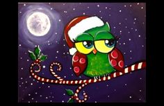 an owl is sitting on a branch with candy canes